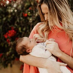 We are Amma nursing cover in Coral color.